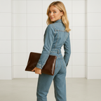 Women's long sleeve denim jumpsuit with straight leg cut side profile