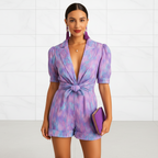 Women's printed short jumpsuit with belted waist angled view