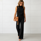 Women's wide leg jumpsuit with round neck and flowing pants angled view